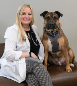 Lakeside Animal Hospital, Doctor Sitting With Big Dog